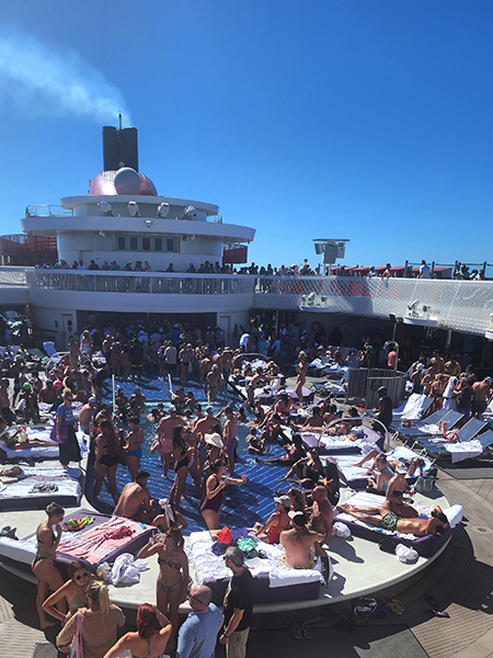 photo of the pool filled with adults, on a Virgin Voyages cruise