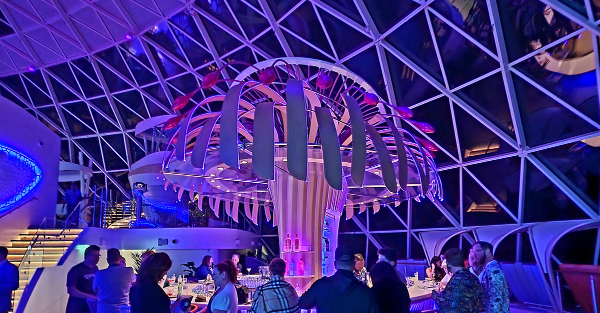 patrons at at the Overlook bar on Royal Caribbean's Icon of the Seas 