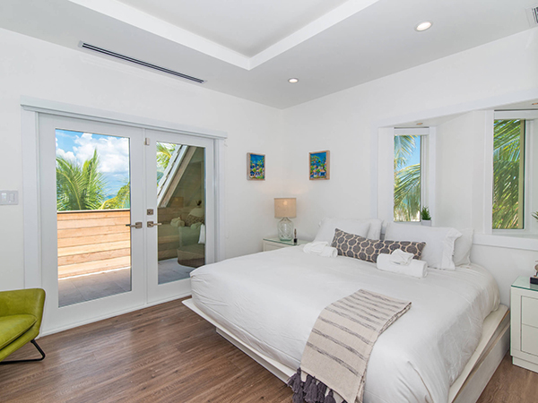 photo of an elegant master bedroom inside a villa in a tropical setting, from the Villas of Distinction. 